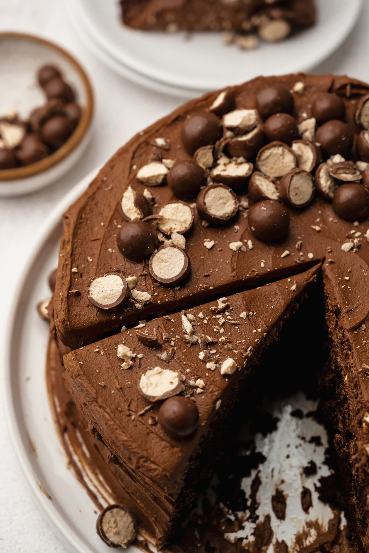 A sliced malt chocolate cake on a plate.