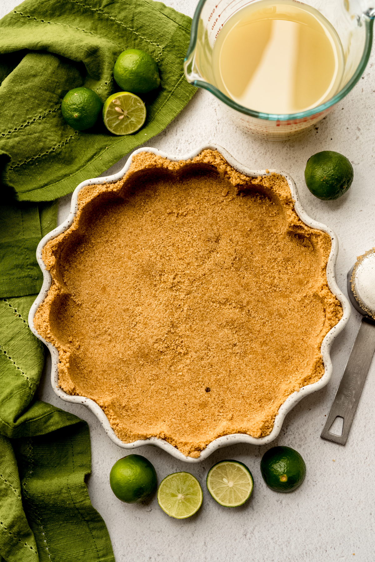 Aerial photo of graham cracker crust in a pie plate.