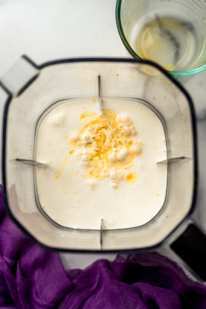 Aerial photo of a blender canister with passion fruit mousse ingredients in it.