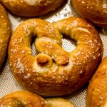 Homemade soft pretzels on a surface.