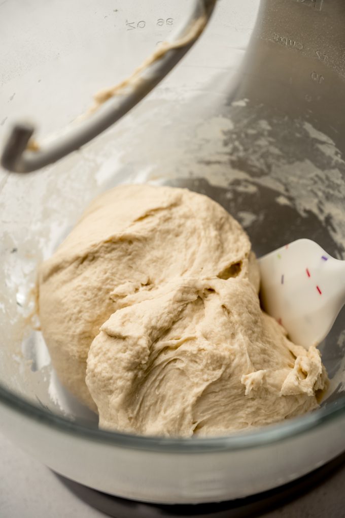 Homemade pretzel dough in the bowl of a stand mixer.