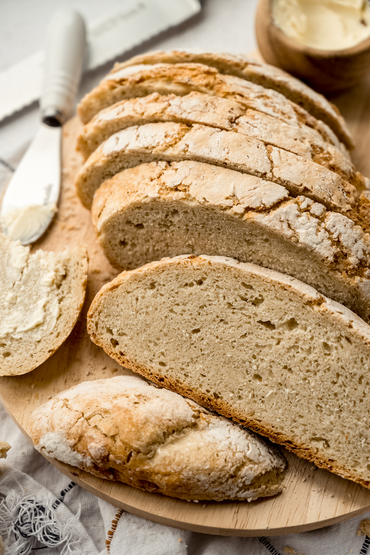 Sliced no knead bread on a surface.