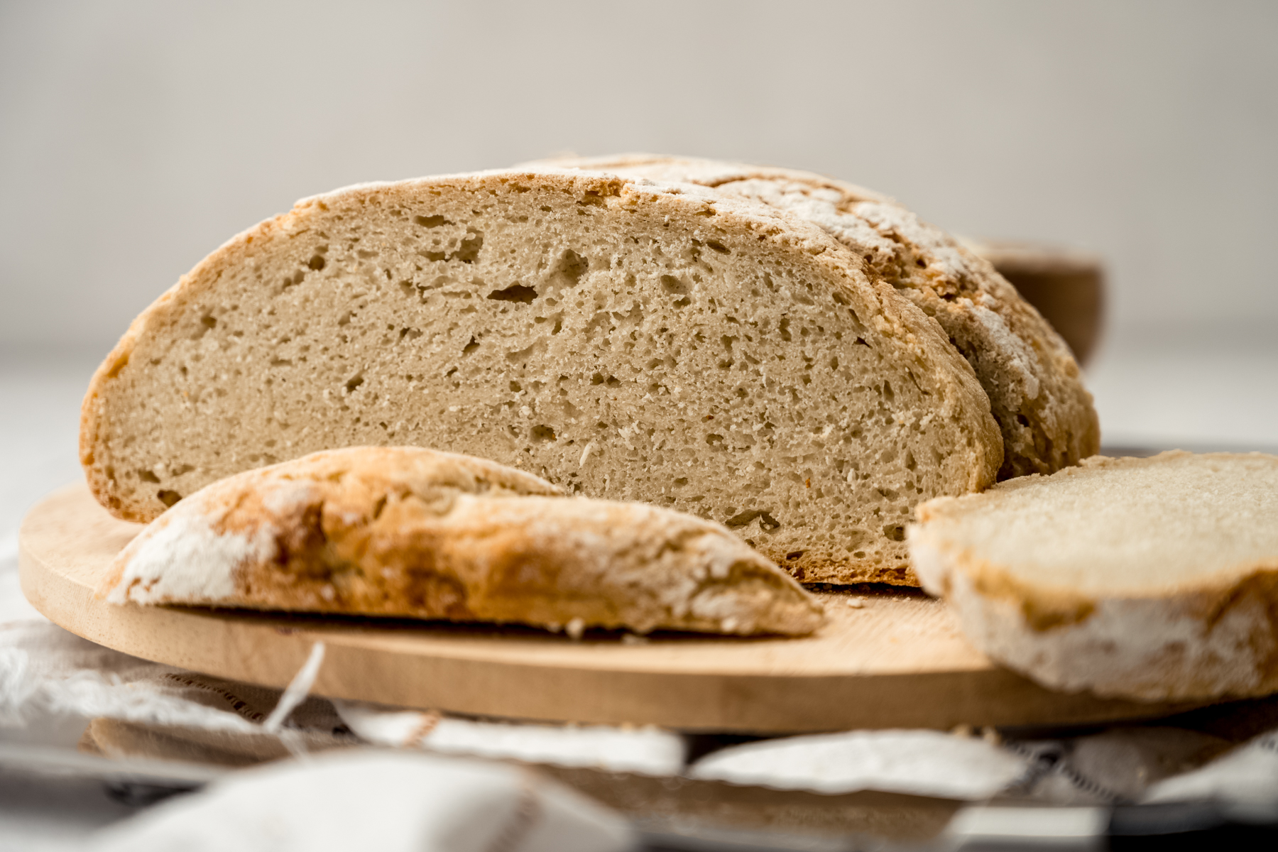 Sliced no knead bread on a surface.