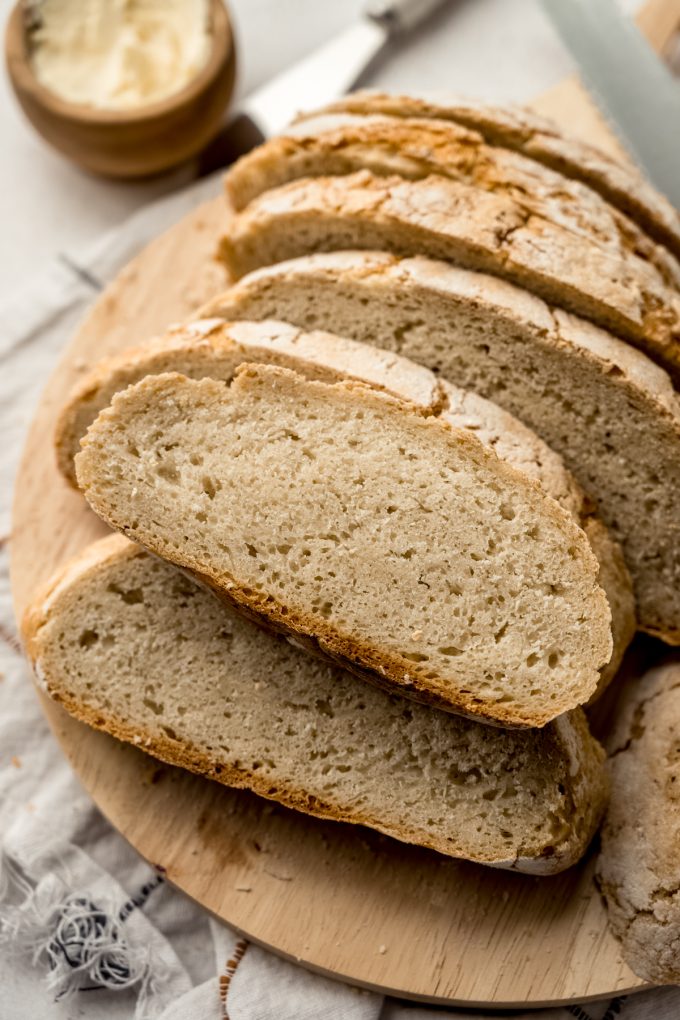 Sliced no knead bread on a surface.