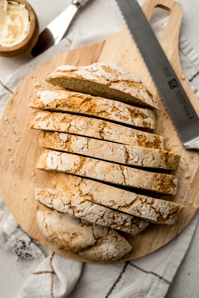 Aerial photo of sliced no knead bread on a surface.