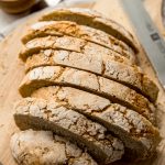 Sliced no knead bread on a surface.