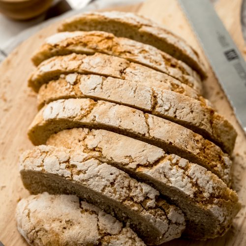Sliced no knead bread on a surface.