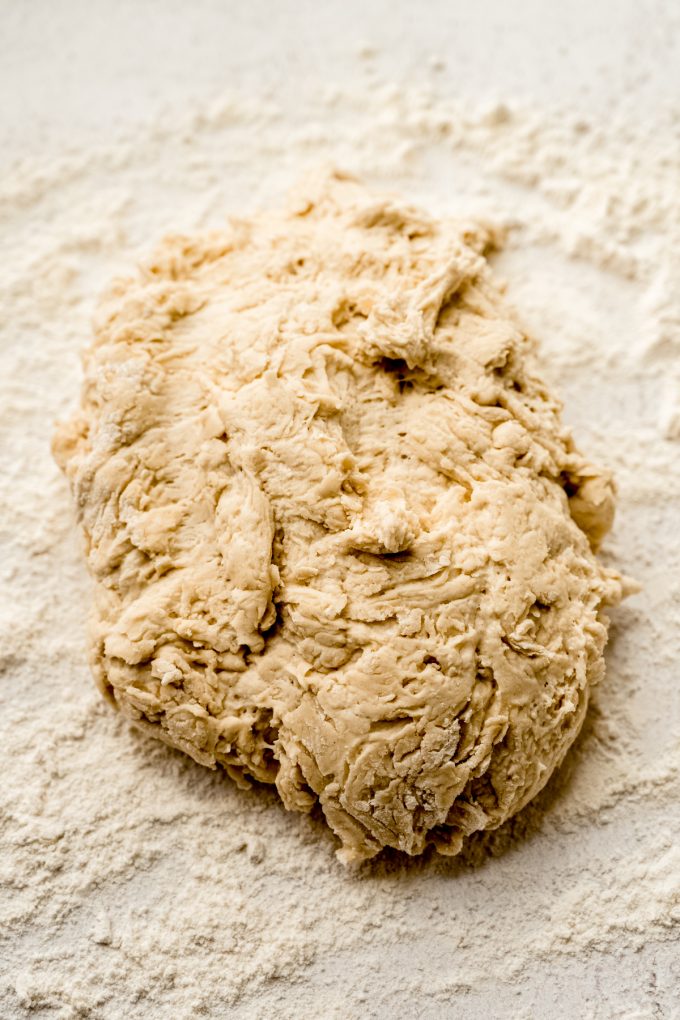 Shaggy bread dough on a surface.