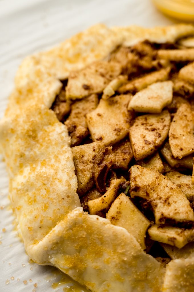 Closeup photo of an apple galette on a baking sheet.