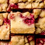 Aerial photo of sliced raspberry cheesecake bars.