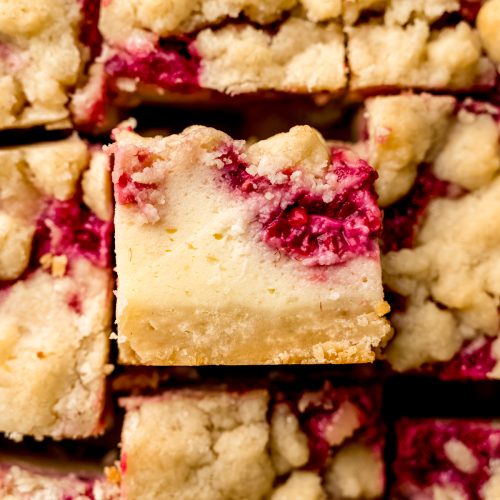 Aerial photo of sliced raspberry cheesecake bars.